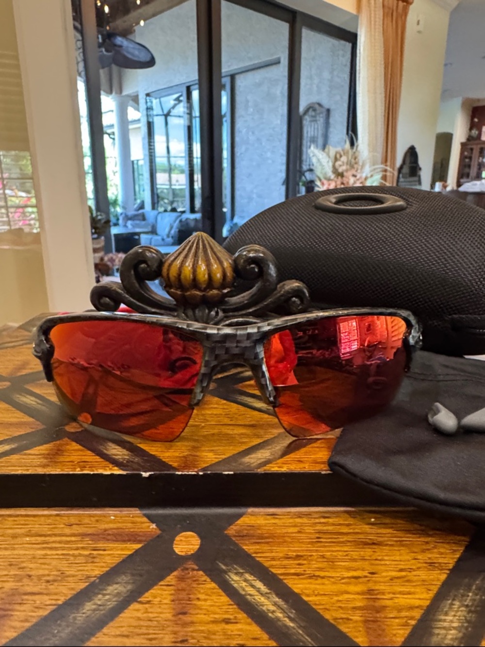 Oakley Sunglasses Black Frame with Red Mirrored Lenses